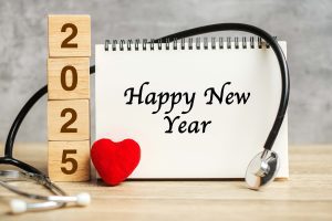 2025 Happy New Year for healthcare, Insurance, Wellness and medical concept. Stethoscope and blank notebook 