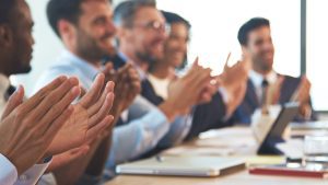Close,Up,Of,Business,Team,Around,Table,In,Modern,Office