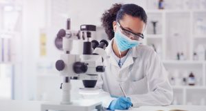 Science,,Writing,And,Microscope,With,Woman,In,Laboratory,For,Expert