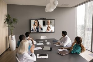 Wide,Shot,Of,Boardroom,With,Clinic,Staff,Of,Doctors,Talking