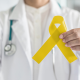 Dr holding Yellow Ribbon