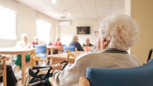 Elderly,Woman,With,Foldable,Walker,In,Nursing,Home