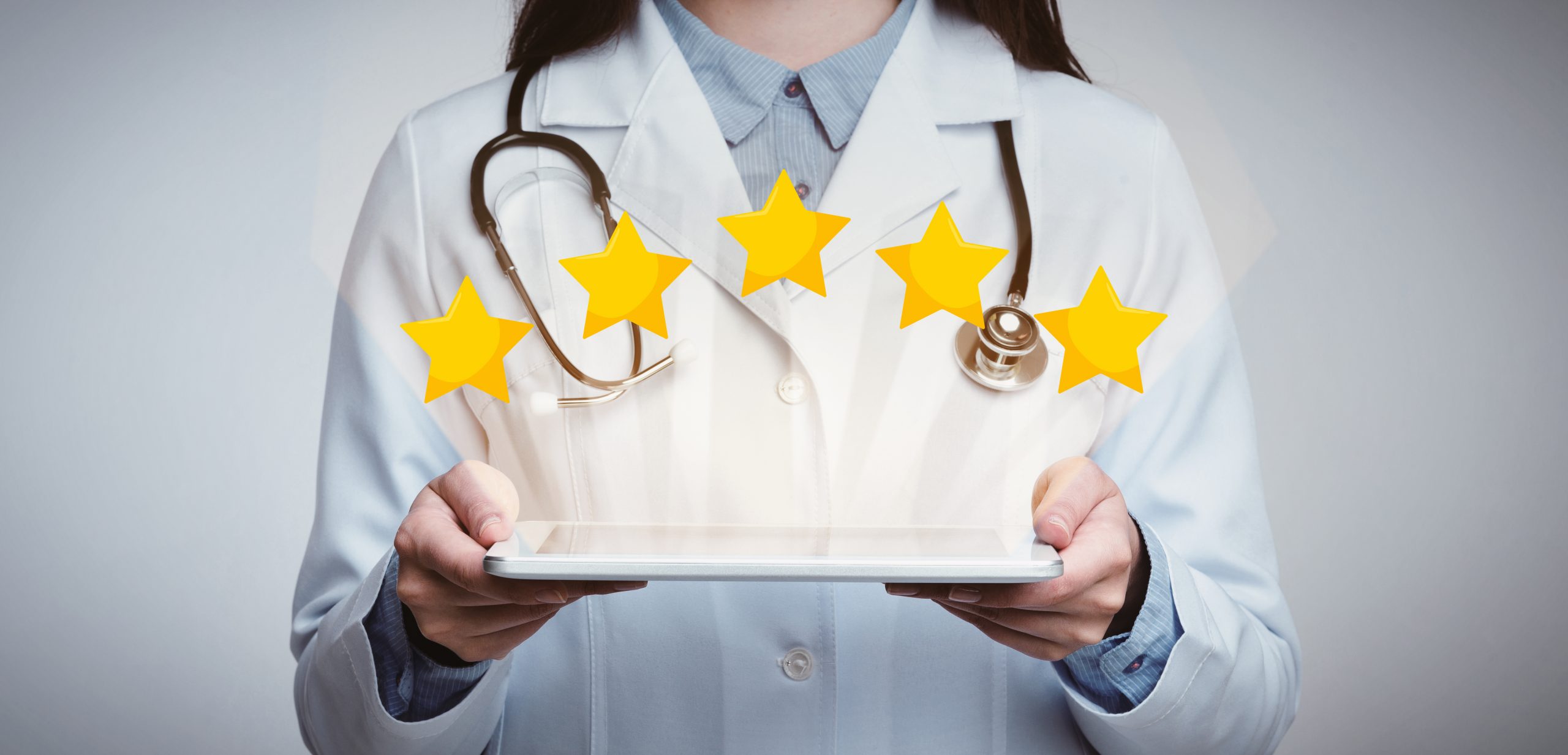 Unrecognizable Female Doctor Holding Digital Tablet With Five Stars Icons Above
