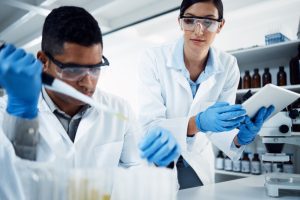 People,,Teamwork,Or,Scientists,On,Tablet,For,Test,Tube,Results,