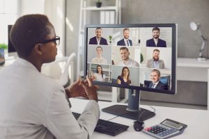 Auditor or tax adviser sharing advice with group of business men and women. Modern telework team of remote colleagues, entrepreneurs, executive managers having online meeting or audit webinar together