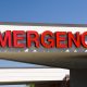 an emergency sign above the emergency entrance to a hospital