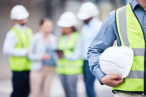 Businessman,,Architect,And,Helmet,For,Safety,In,Construction,,Project,Management