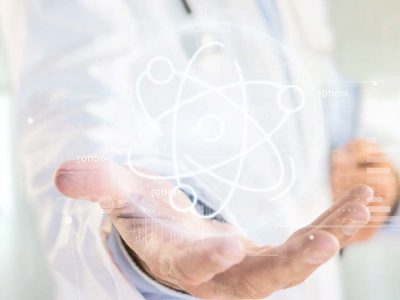 View of a Doctor holding an atom icon surrounded by data