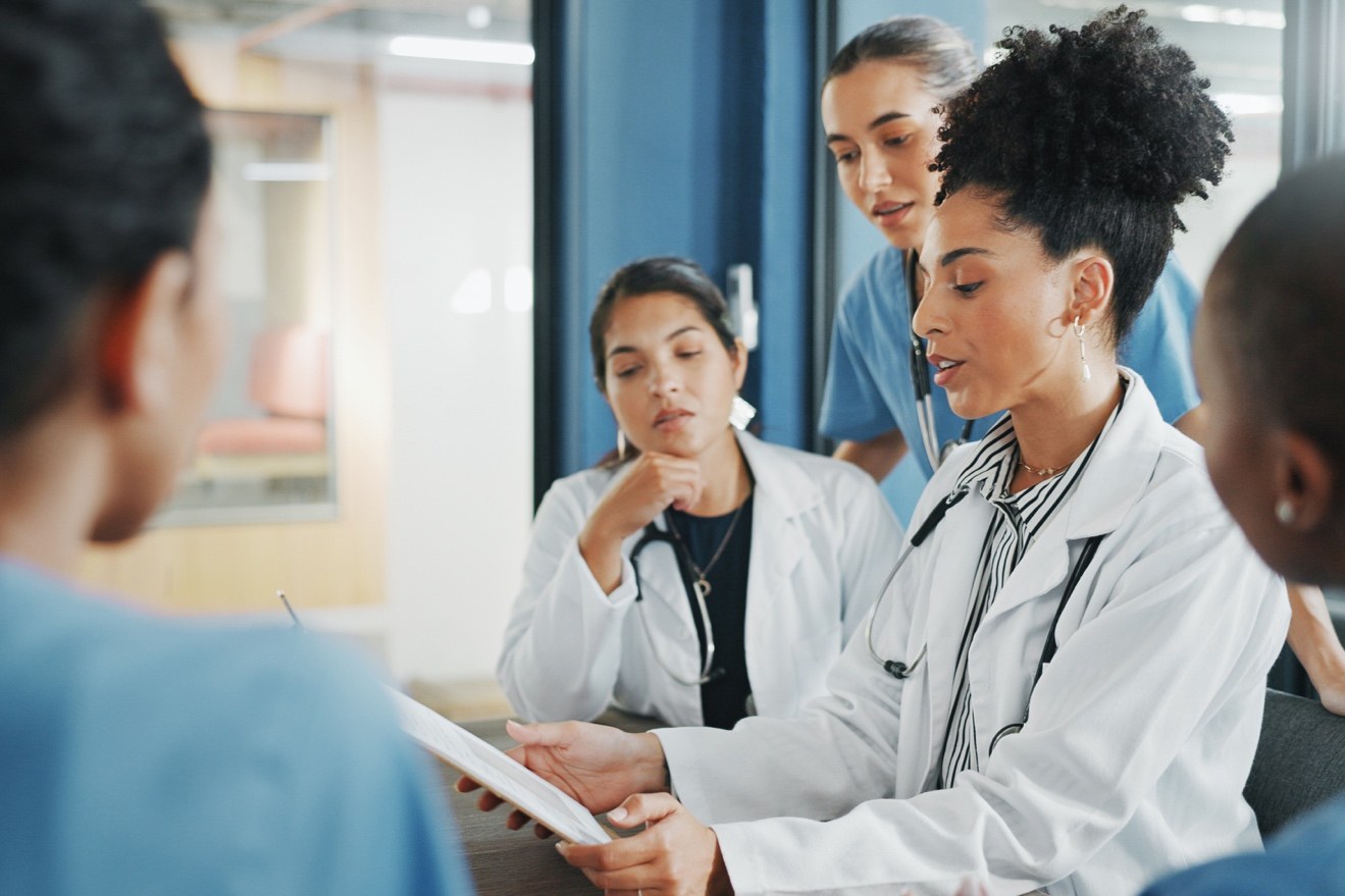 Healthcare professionals reviewing credentialing documentation