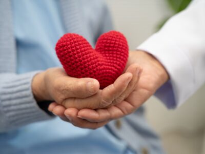 woman holding a handmaid heart gift
