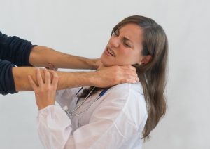 Doctor being chocked by a patient.