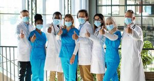 doctor-group-wearing-masks-giving-thumbs-up