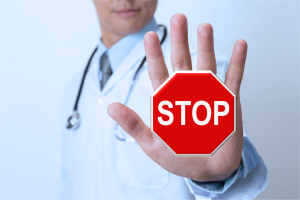 doctor-holding-hand-up-stop