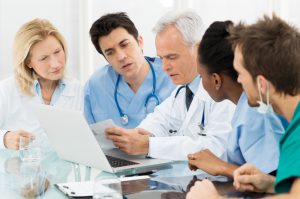 Team,Of,Expert,Doctors,Examining,Medical,Reports,At,Hospital