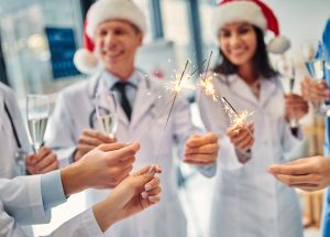 Merry,Christmas,And,Happy,New,Year!,Group,Of,Doctors,Celebrating