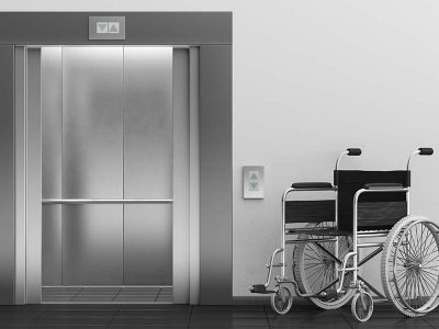 Open Elevator Doors with a wheel chair in front of doors