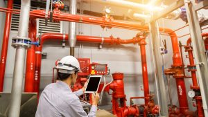 Engineer,With,Tablet,Check,Red,Generator,Pump,For,Water,Sprinkler