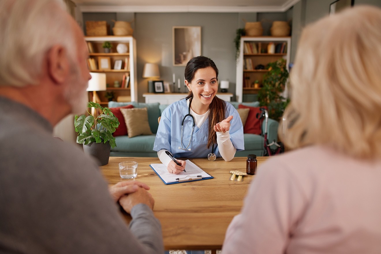Hospice care discussion with an older couple and healthcare professional