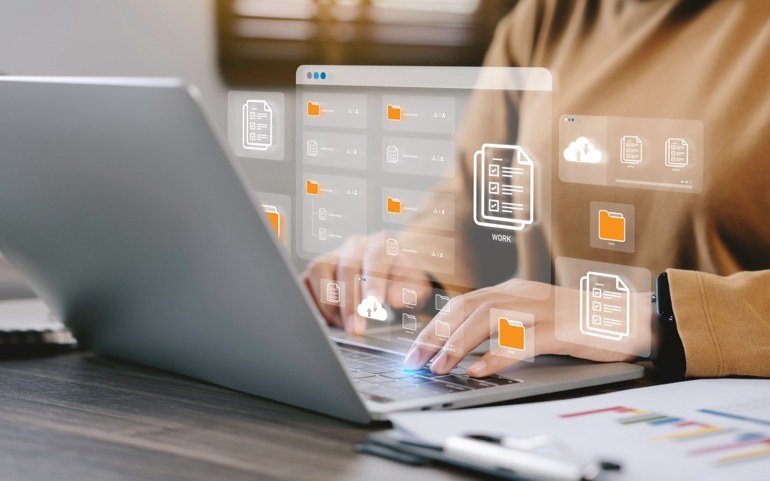 Professional using digital document resources on a laptop
