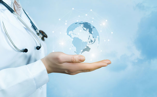 A female doctor with a stethoscope on her neck is holding a crystal, sparkling global map on her hand against the blue sky background. (A female doctor with a stethoscope on her neck is holding a crystal, sparkling global map on her hand against the ball