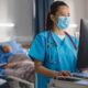 nurse looking in computer