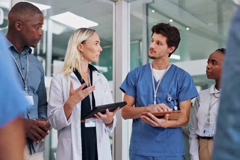 Healthcare professionals discussing quality performance