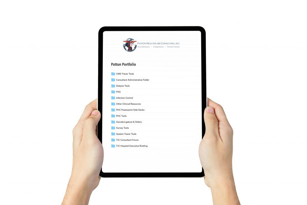 Hand holding digital tablet containing a listing of Patton Portfolio tools