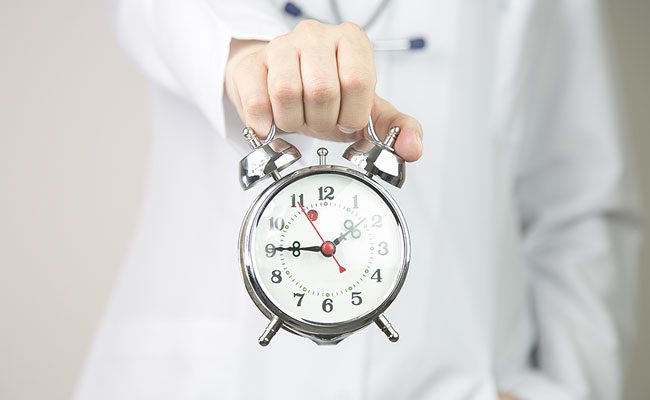 Medical background doctor with clock.