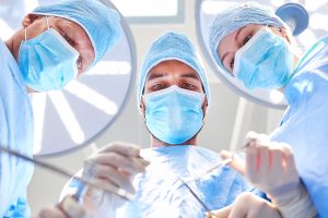 three doctors over-patient during surgery-operation