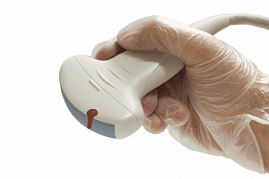 Dr holding a ultrasound Transducers wand